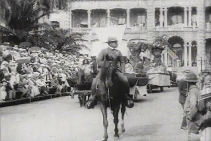 1960s - A festive parade on a street in Hawaii in 1918.
