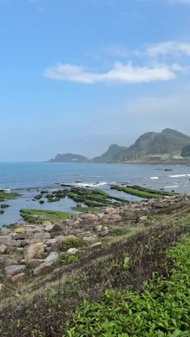 A scenic viewing area with rugged terrain and a vast ocean outlook. It
