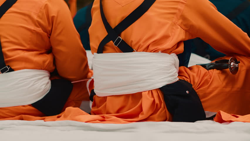 Indian Vaisakhi tradition with seated soldiers in orange uniforms