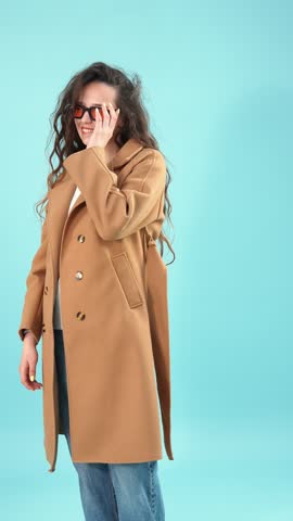 Young woman wearing sunglasses and looking away with a smile