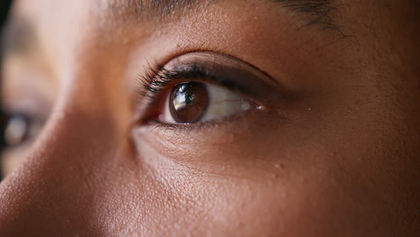 Close up African American business woman eye looking camera portrait detail vision eyesight businesswoman female mascara eyelashes makeup sight ophthalmology contact lenses laser treatment macro shot