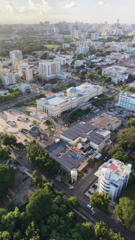Aerial view of the National Palace (Palacio Nacional) of the Dominican Republic in Santo Domingo. Cinematic drone shot of the neoclassical government building and its gardens.