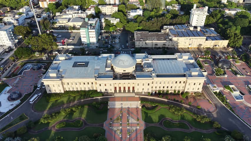 Aerial view of the National Palace (Palacio Nacional) of the Dominican Republic in Santo Domingo. Cinematic drone shot of the neoclassical government building and its gardens.