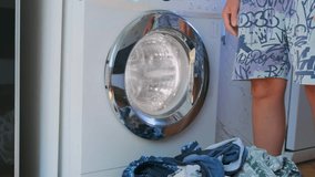 Woman taking clean clothes out of front load washing machine at home. Laundry routine after washing cycle, removing wet garments, domestic chores, hygiene and everyday household maintenance. - Powered by Shutterstock - Get 15% off with code: PIKWIZARD15