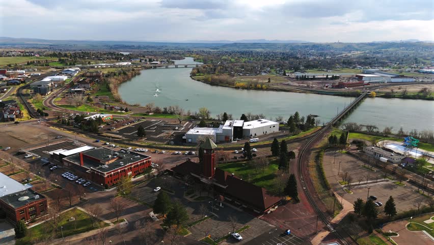Spring aerial view of Great Falls riverfront and rail depot