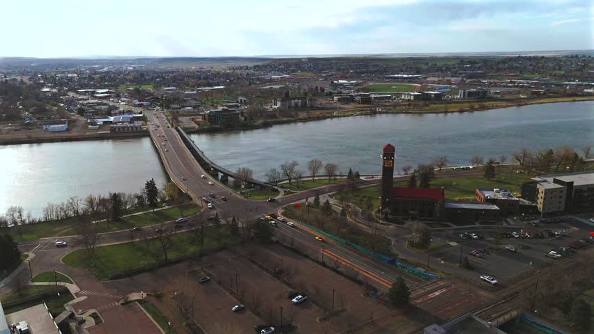 Drone orbit around historic depot and river bridge in Montana