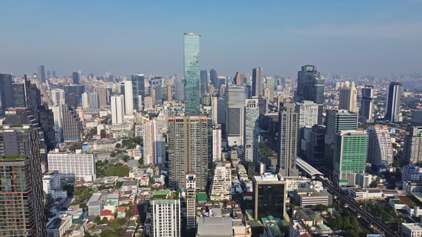 Aerial high view of Bangkok city, urban skyscrapers and office buildings in business district, Thailand, panorama 4k
