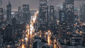 Cityscape boasts towering skyscrapers and bustling streets, illuminated by car lights and city glow, showcasing vibrant urban life and dynamic motion against night sky. - Powered by Shutterstock - Get 15% off with code: PIKWIZARD15