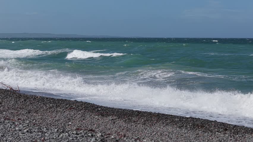 Powerful ocean waves crashing on a rocky shoreline