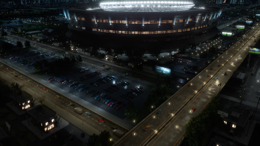 Aerial Shot: Soccer Championship Match at Packed Football Stadium at Night, With Fans Cheer at Decisive Final Cup in Big Arena. Cinematic Moving Drone Overhead Aerial.