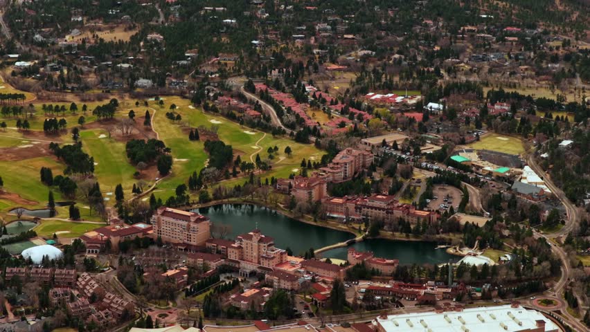 The Broadmoor Hotel and Golf Club Front Range Rocky Mountains landscape Colorado Springs Colorado aerial drone Cheyenne lake winter s morning blue sky clouds Colorado