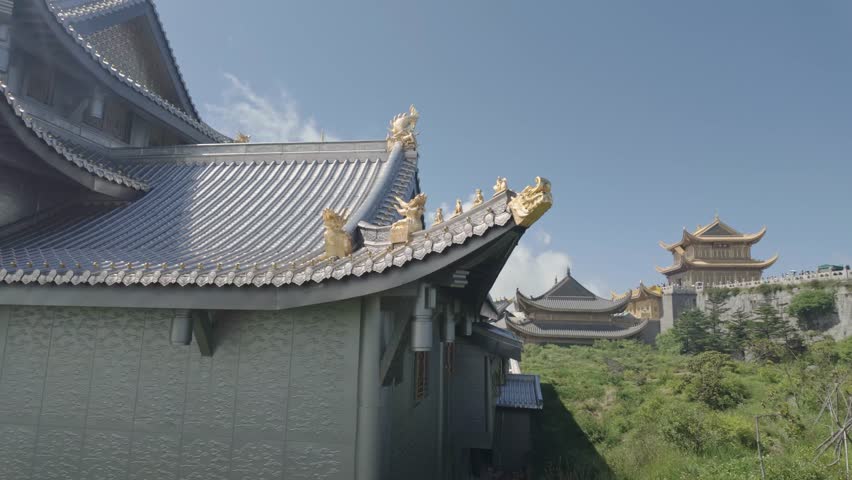 Mount Emei traditional buddhist temple architecture, roof with eaves and decorative figurines