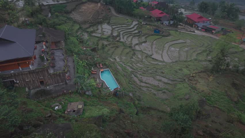Aerial view of terraced fields and rural nature.