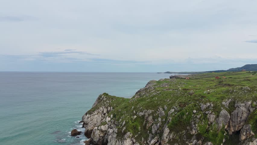 Breathtaking aerial view of a rugged coastline and beach.