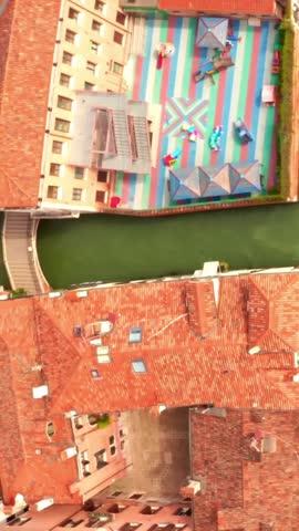 Aerial drone view of Venice Italy historic canals, architecture, bridges, and scenic cityscape.