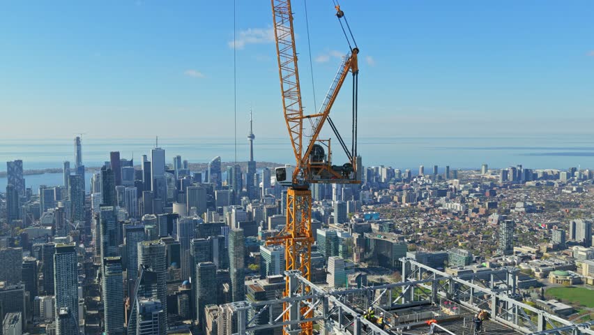 Urban construction crane building skyscraper in Toronto