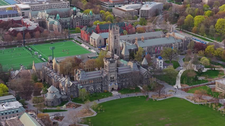 University of Toronto campus featuring gothic revival architecture of University College building and Back Campus sports field over King