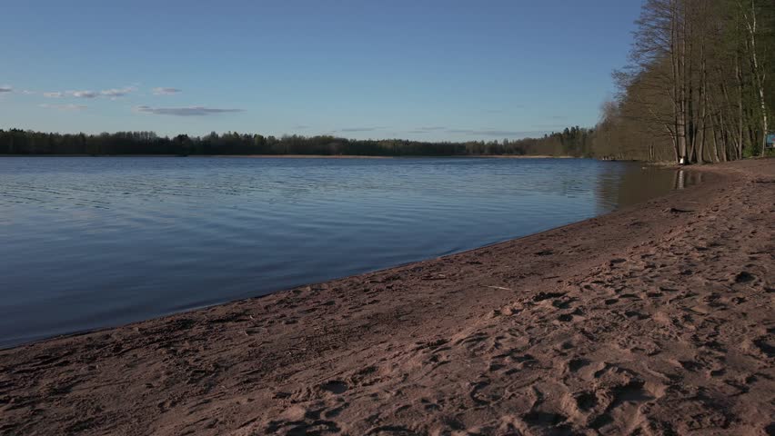 Slowly ascending over a calm lake in Espoo Finland