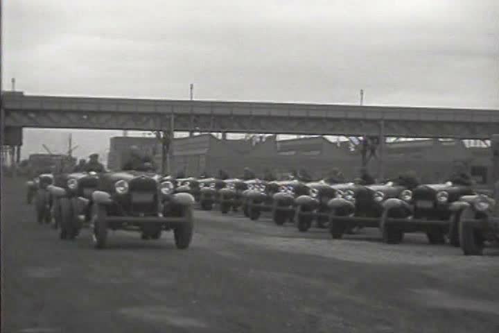 1920s - New cars parade down city streets in 1926.