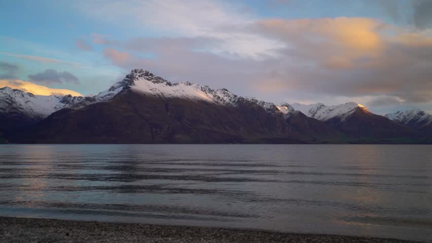 Winter Queenstown Bay Beach sunrise sunset Lake Wakatipu Queenstown Gardens New Zealand South Island landscape nature view Glenorchy snow covered peaks morning cloudy golden hour peaceful calm water