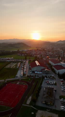Vertical scene of sports centre hall and school grounds in Logatec
