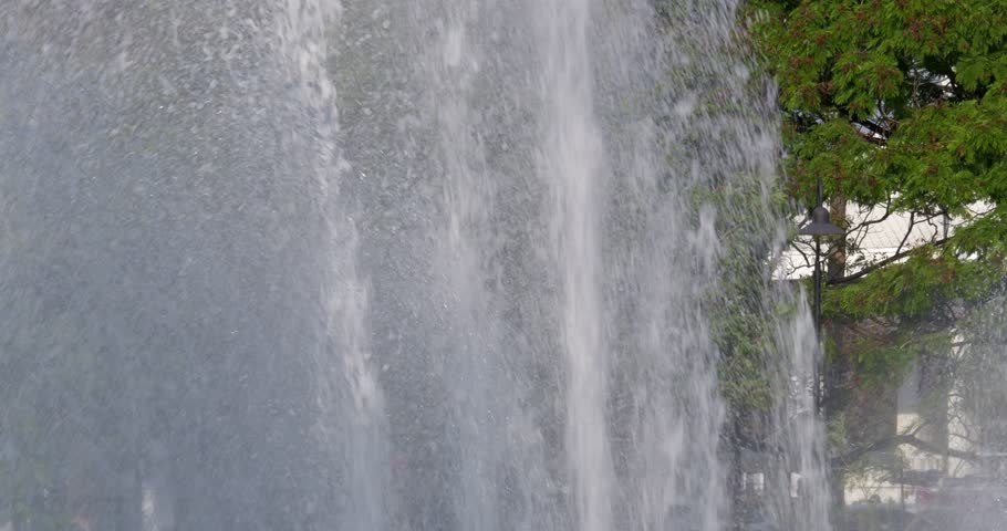 A stunning waterfall cascades down with lush surroundings capturing essence of nature