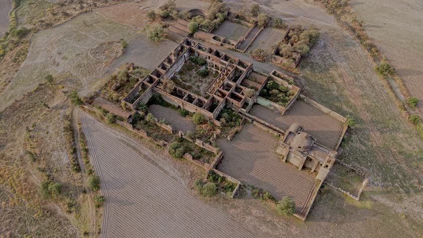 Aerial view flying away from the ruins of the abandoned caxcantla ex hacienda in puebla, mexico