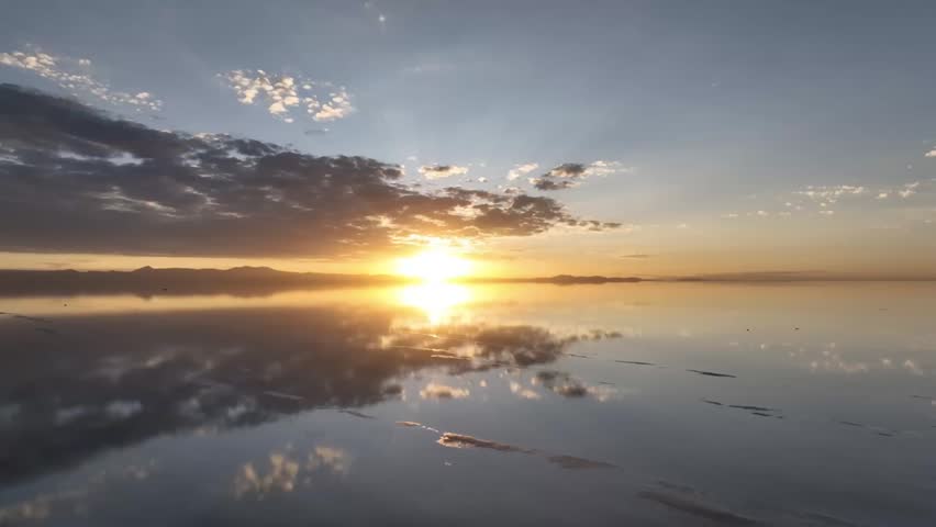 Salar de Uyuni in Bolivia during sunset. Aerial image Rainy Season.Time lapse.