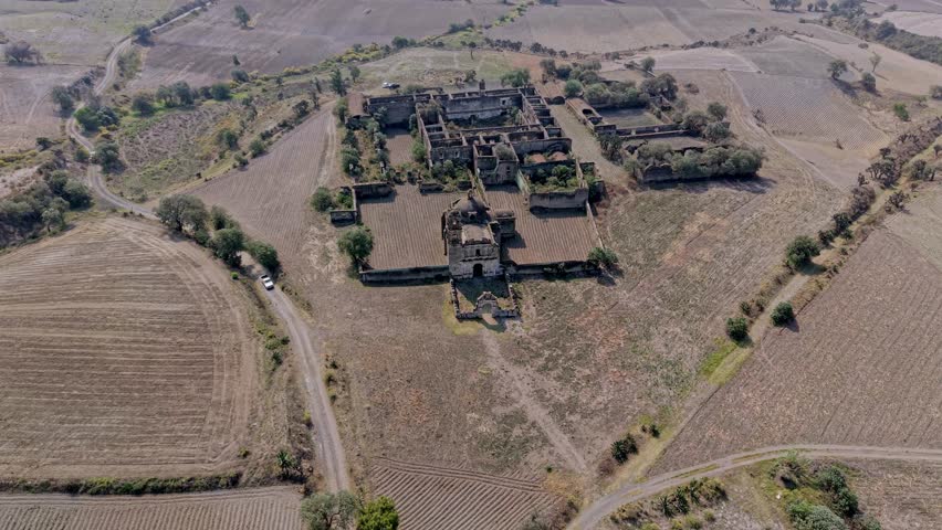Aerial view of the ruins of the ex hacienda caxcantla in puebla, mexico, amidst agricultural fields