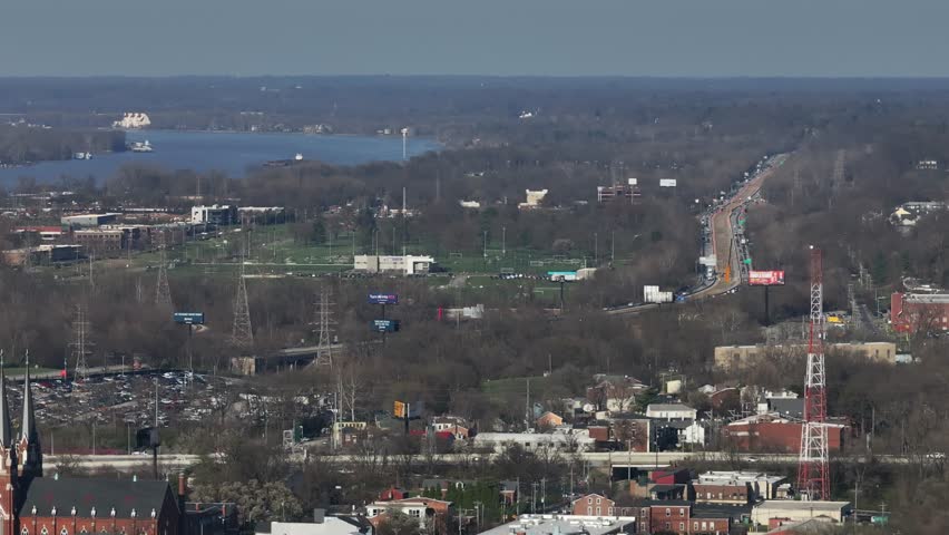 Aerial view of the Ohio River, highways with traffic, and a radio tower in Louisville, Kentucky, United States.