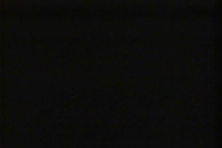 1930s - The assembly line at an automobile factory in 1936.