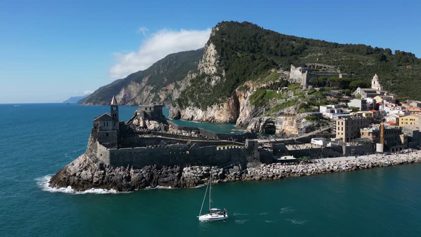 Italy, Liguria, The Church of San Pietro in Portovenere in the province of La Spezia, perched on a rocky spur overlooking the sea, is a Gothic-Genoese jewel from the 13th century - drone view , tourist attraction destination sightseeing