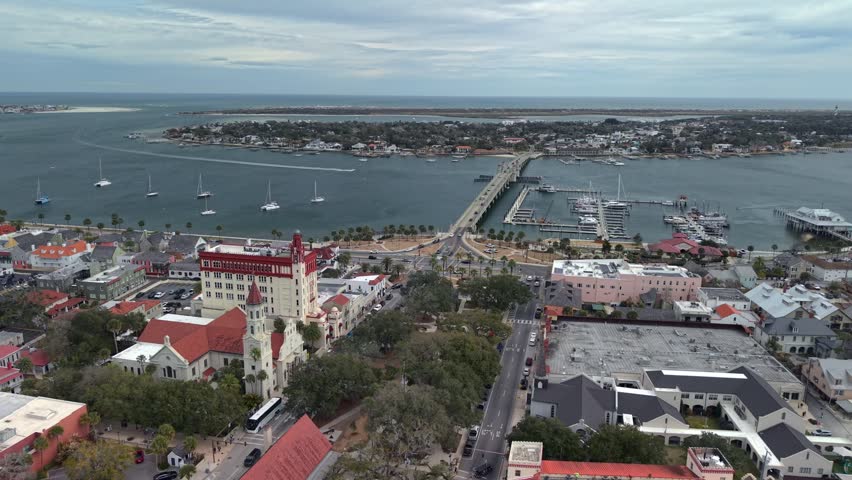 Aerial view of the Bridge of Lions spanning the Matanzas River with the historic district and sailboats in St. Augustine, Florida, United States.