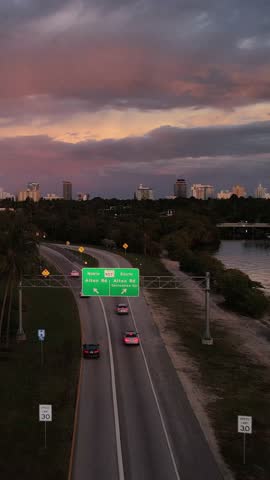 Cinematic Aerial View of Highway Leading to Miami South Beach at Blue Hour. Miami Florida