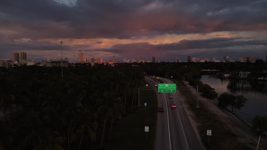 Cinematic Aerial View of Highway Leading to Miami South Beach at Blue Hour. Miami Florida