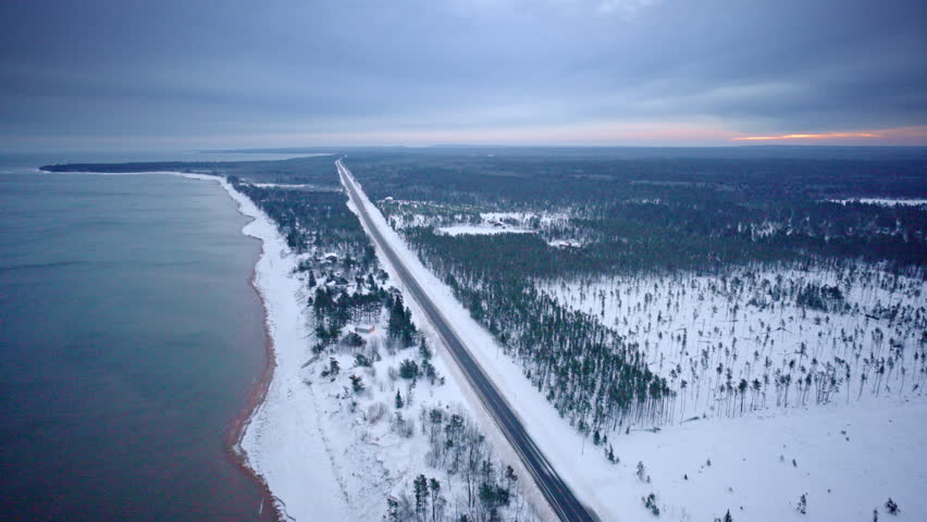 Scenic aerial footage of winter landscapes surrounding Lake Superior