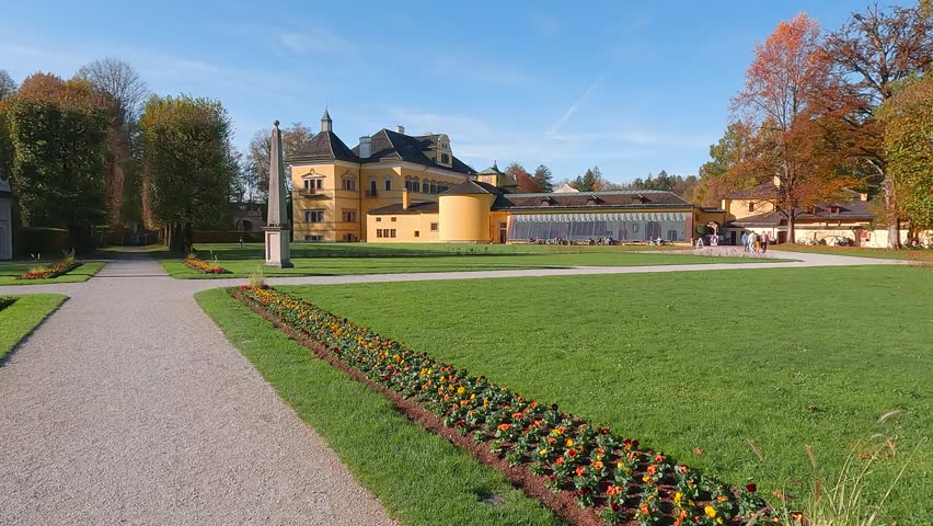 Attractive autumn view of Hellbrunn castle, Austria, Europe. Spectacular morning cityscape of Morzg, district of Salzburg city, Austria, Europe. 4K video (Ultra High Definition).