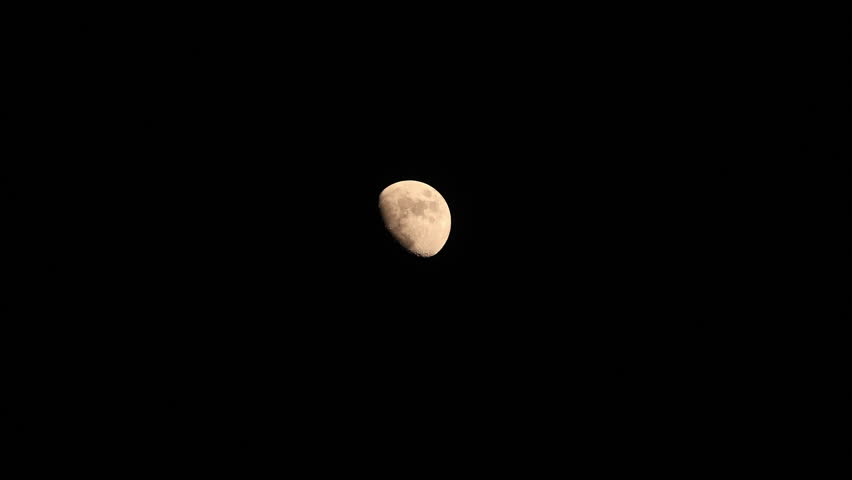 Waxing gibbous Moon on a dark evening sky.