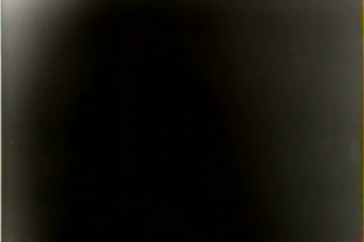 1940s - Women play badminton in a gym in 1941.