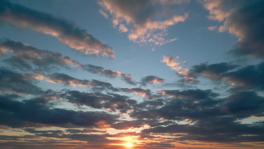 Beautiful sun setting behind a hill silhouette
