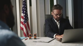 U.S. embassy employee rejecting man's visa application and issuing entry refusal - Powered by Shutterstock - Get 15% off with code: PIKWIZARD15