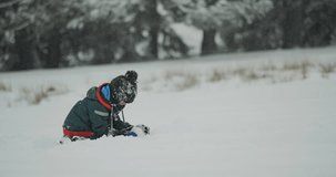 Child building a castle in the snow, enjoy winter in nature - Powered by Shutterstock - Get 15% off with code: PIKWIZARD15
