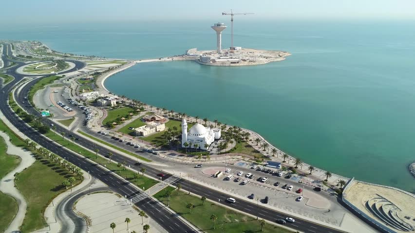 Aerial coastal landscape of Al Khobar Corniche with the famous water tower island, highways, and Arabian Gulf shoreline in Saudi Arabia.