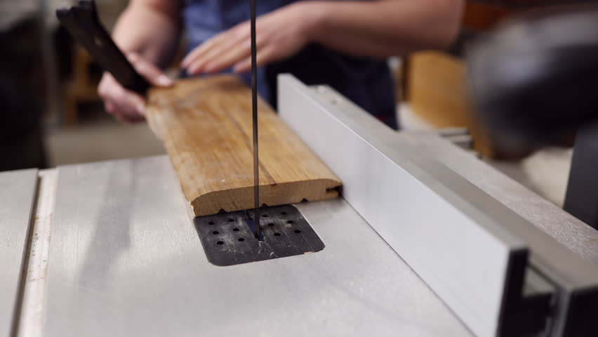 Woman Operating Woodworking Machine in Carpentry Studio