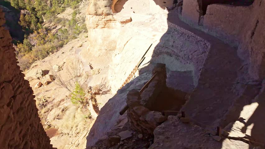 Interior vantage reveals ancient cliff dwellings carved into rock walls at Gila Cliff Dwellings National Monument in New Mexico