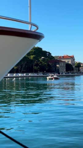 Beautiful waterfront view in Dubrovnik, Croatia, featuring calm Adriatic Sea, marina atmosphere, and Mediterranean coastal architecture.