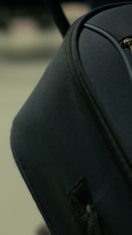 Close up of passengers with carry-on trolley bags for travel scene, multiethnic people in crowded bus station ready for intercity coach and long-haul journey. Cross-country travel.