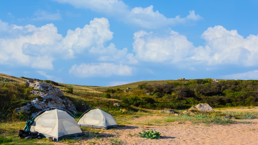 touristic camp among a green hills time lapse scene