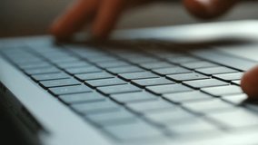Detailed close up human fingers typing on modern laptop computer keyboard, representing remote work, online communication, freelancing, digital business tasks. Person hands typing on laptop keyboard - Powered by Shutterstock - Get 15% off with code: PIKWIZARD15