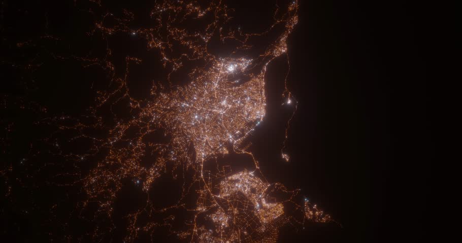 Kingston (Jamaica) top view at night. Top view on modern city with street lights and glow effect. Camera is zooming in, rotating clockwise. Vertical video. The north is on the left side